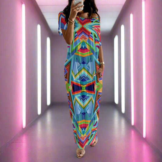Woman wearing a colorful patterned dress in a neon lit hallway