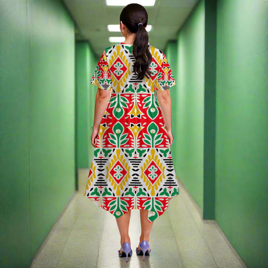 Woman wearing a colorful patterned dress on a plain background