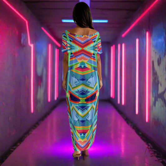 Woman in a colorful dress standing in a neon lit hallway