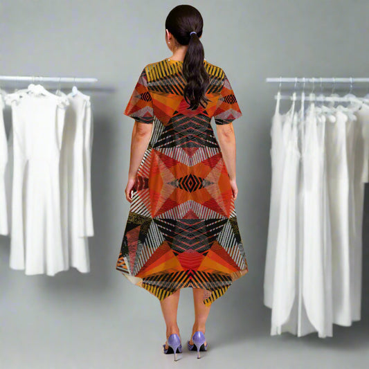 Woman wearing a colorful patterned dress on a beige background